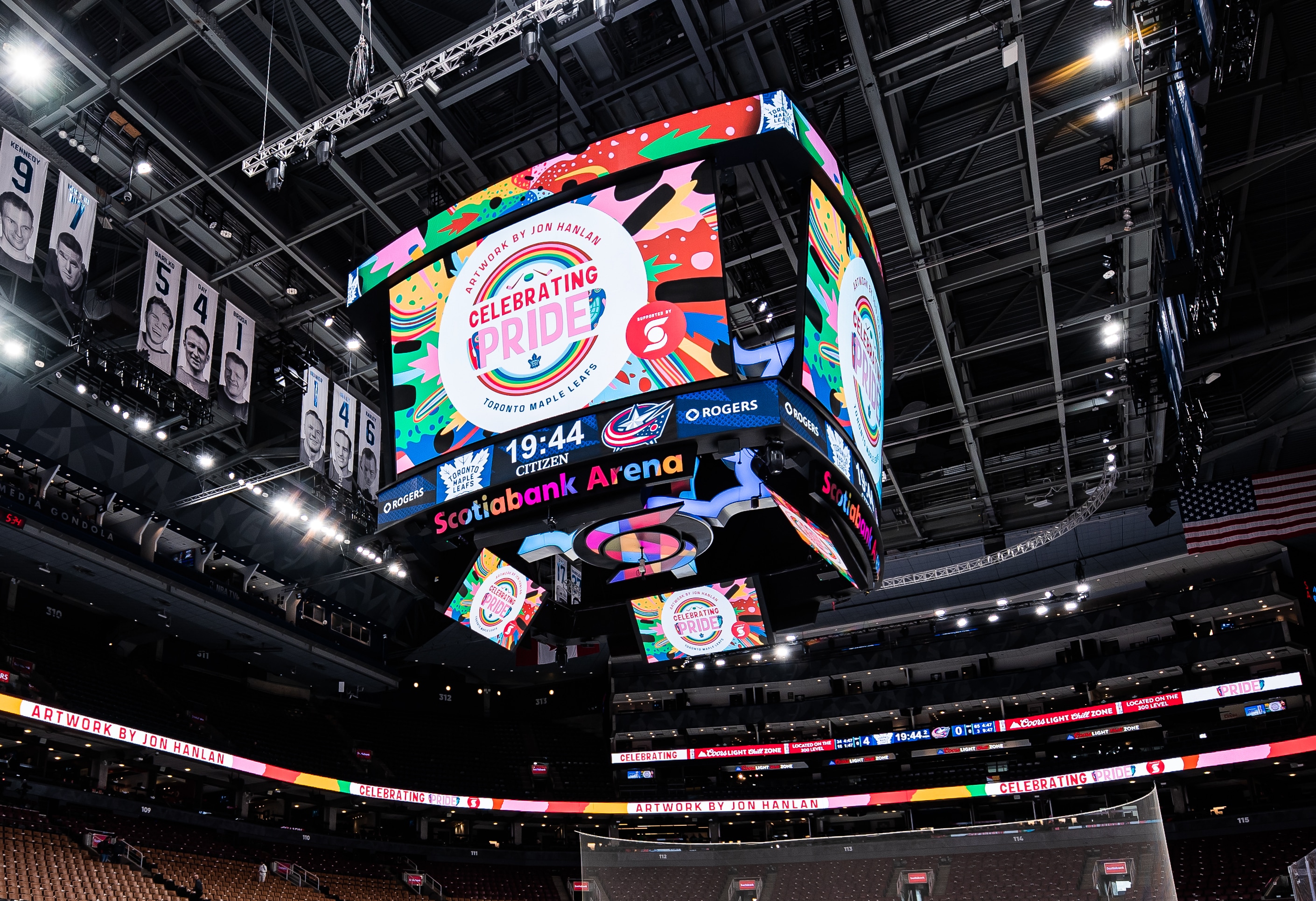 The main scoreboard and ribbon boards, credited "Artwork by Jon Hanlan".